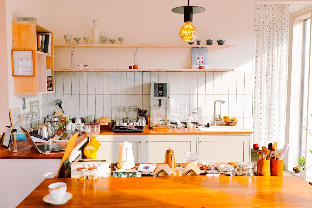 Czech home kitchen counter with wooden utensils, ceramic bowls and flour