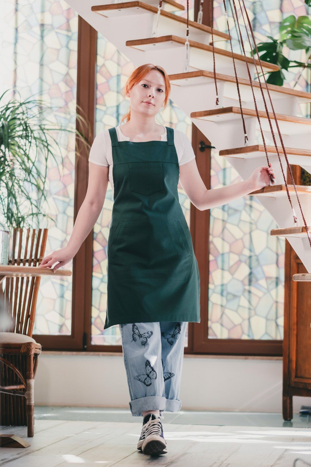 Portrait of a Czech woman in her forties wearing a linen kitchen apron