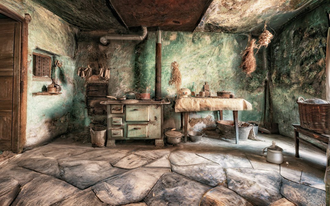 Warm Czech home kitchen interior with wooden table and ceramic plates