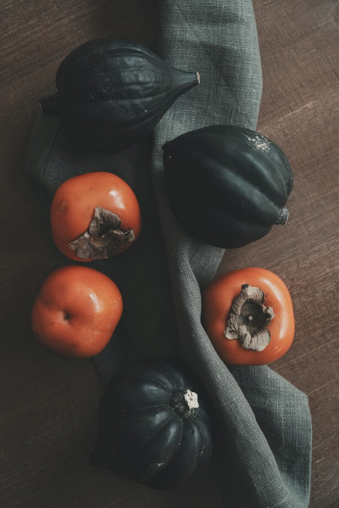 Autumn kitchen table with apples, plums, mushrooms and a pumpkin in the Czech Republic